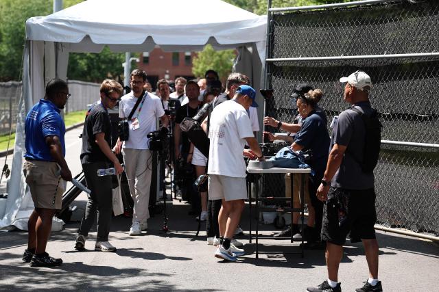 Members of the media pass through a security check point ahead of a training session of the France team during the 2026 World Cup football tournament at Bentley University in Waltham, Boston on June 11, 2026. (Photo by FRANCK FIFE / AFP)