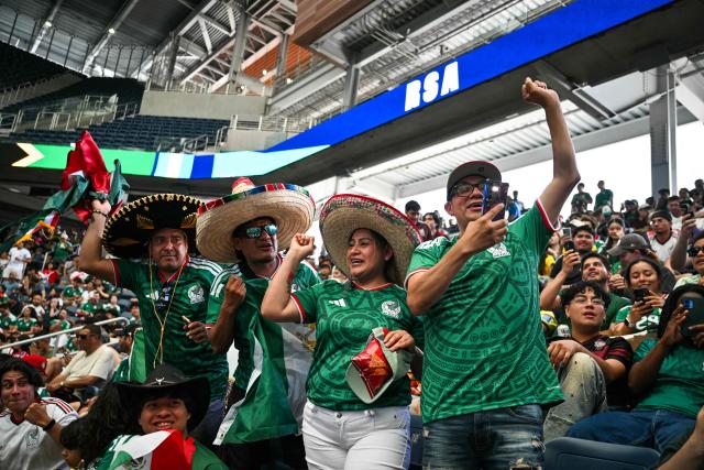 Mexican fans cheer at a watch party before the opening match of the 2026 World Cup football tournament at the "Queens Group Stage HQ" at USTA Billie Jean King National Tennis Center in New York on June 11, 2026. (Photo by ANGELA WEISS / AFP)