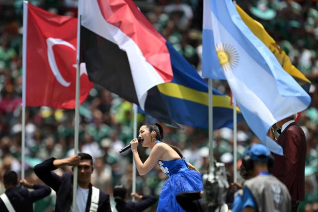 South Korean–American singer, songwriter, and record producer Ejae performs during the opening ceremony ahead of the 2026 World Cup Group A football match between Mexico and South Africa at the Mexico City Stadium in Mexico City on June 11, 2026. (Photo by Yuri CORTEZ / AFP)