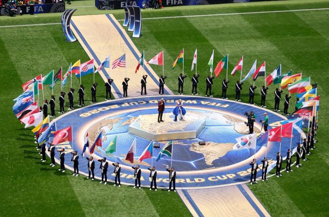 Italian singer Andrea Bocelli and South Korean-American singer and songwriter Ejae perform during the opening ceremony ahead of the 2026 World Cup Group A football match between Mexico and South Africa at the Mexico City Stadium in Mexico City on June 11, 2026. (Photo by Rodrigo OROPEZA / AFP)