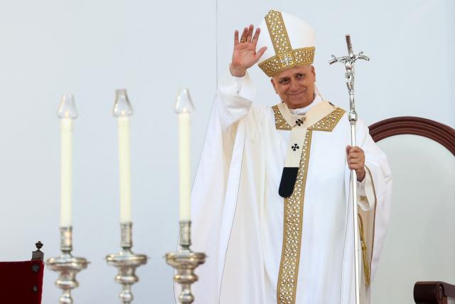 Pope Leo XIV waves during a Holy mass at the Gran Canaria Stadium in Las Palmas on the Canary Island of Gran Canaria on June 11, 2026. Pope Leo XIV is visiting Spain June 6-12 with stops in Madrid, Barcelona, and the Canary Islands, where he will meet with migrants and organisations dedicated to helping them. (Photo by Pierre-Philippe MARCOU / AFP)