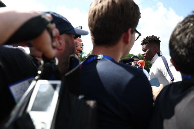 France's goalkeeper #01 Brice Samba (R) speaks to the media ahead of a training session during the 2026 World Cup football tournament at Bentley University in Waltham, Boston on June 11, 2026. (Photo by FRANCK FIFE / AFP)