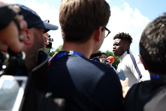 France's goalkeeper #01 Brice Samba (R) speaks to the media ahead of a training session during the 2026 World Cup football tournament at Bentley University in Waltham, Boston on June 11, 2026. (Photo by FRANCK FIFE / AFP)