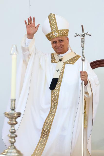 Pope Leo XIV waves during a Holy mass at the Gran Canaria Stadium in Las Palmas on the Canary Island of Gran Canaria on June 11, 2026. Pope Leo XIV is visiting Spain June 6-12 with stops in Madrid, Barcelona, and the Canary Islands, where he will meet with migrants and organisations dedicated to helping them. (Photo by Pierre-Philippe MARCOU / AFP)