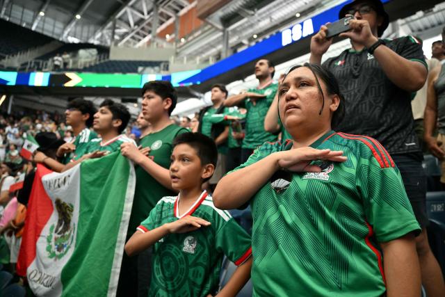 Fans sing the Mexican national anthem at a watch party before the opening match of the 2026 World Cup football tournament at the "Queens Group Stage HQ" at USTA Billie Jean King National Tennis Center in New York on June 11, 2026. (Photo by ANGELA WEISS / AFP)