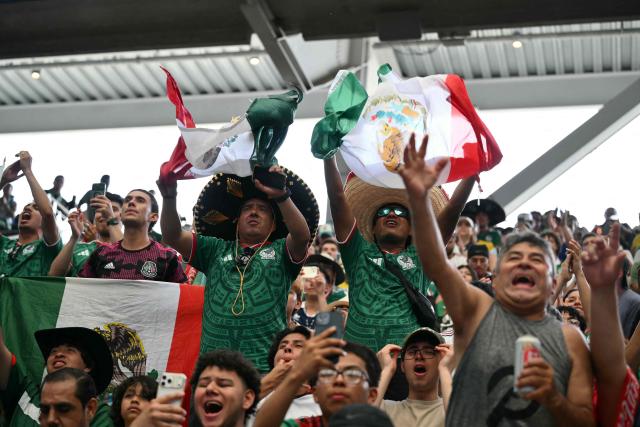 Mexican fans cheer at a watch party before the opening match of the 2026 World Cup football tournament at the "Queens Group Stage HQ" at USTA Billie Jean King National Tennis Center in New York on June 11, 2026. (Photo by ANGELA WEISS / AFP)