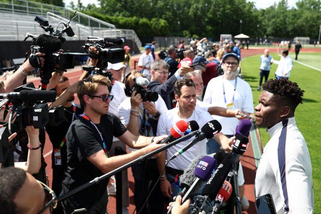 France's goalkeeper #01 Brice Samba (R) speaks to the media ahead of a training session during the 2026 World Cup football tournament at Bentley University in Waltham, Boston on June 11, 2026. (Photo by FRANCK FIFE / AFP)