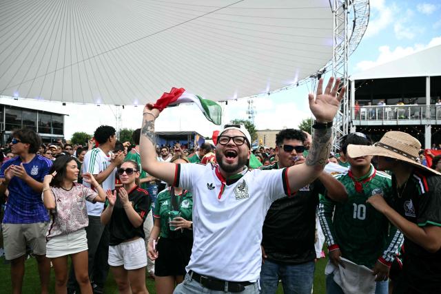 Mexican fans cheer at a watch party before opening match of the 2026 World Cup football tournament at the FIFA Fan Zone in Houston, Texas, on June 11, 2026. (Photo by RONALDO SCHEMIDT / AFP)