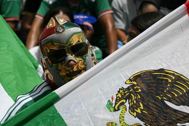 A Mexican fan cheers at a watch party before the opening match of the 2026 World Cup football tournament at the FIFA Fan Zone in Houston, Texas, on June 11, 2026. (Photo by RONALDO SCHEMIDT / AFP)