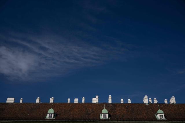 A photograph taken on June 11, 2026 shows chimneys on the roof of Austrian Presidential palace located in Hofburg palace in the late afternoon light, in Vienna. (Photo by Joe Klamar / AFP)