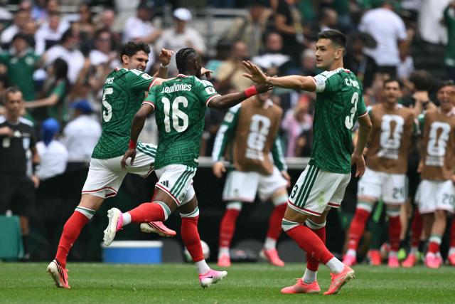 Mexico's forward #16 Julian Quinones celebrates scoring his team's first goal with teammates defender #15 Israel Reyes and defender #03 Cesar Montes during the 2026 World Cup Group A football match between Mexico and South Africa at the Mexico City Stadium in Mexico City on June 11, 2026. (Photo by Yuri CORTEZ / AFP)
