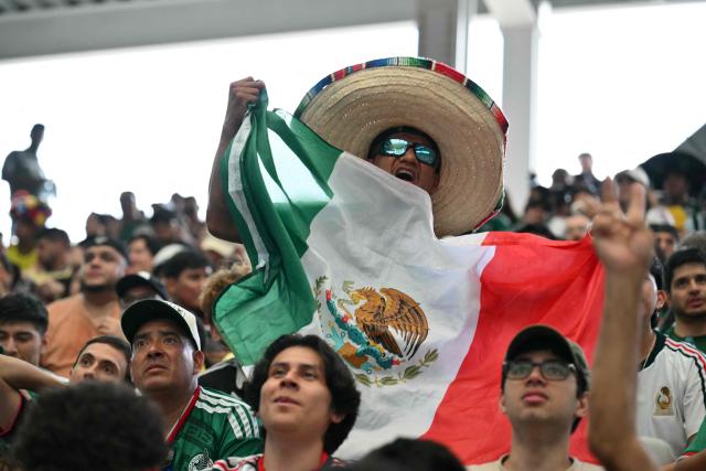 A fan celebrates Mexico's first goal in the opening match of the 2026 World Cup football tournament during a watch party at the "Queens Group Stage HQ" at USTA Billie Jean King National Tennis Center in New York, on June 11, 2026. (Photo by ANGELA WEISS / AFP)