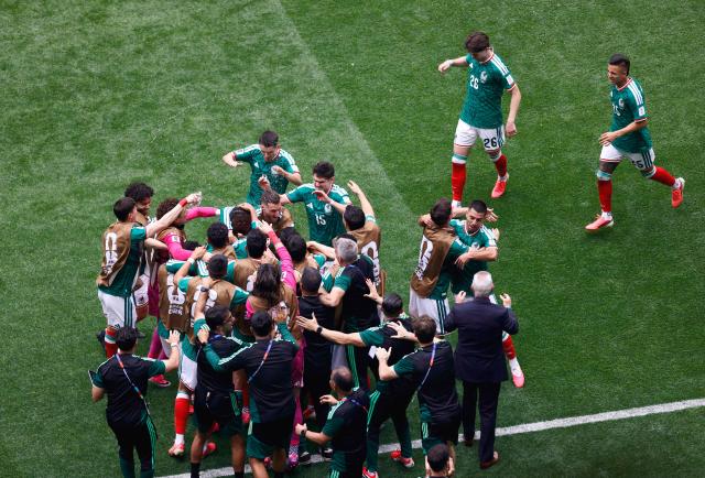 Mexico’s players celebrate the team’s first goal scored by forward #16 Julian Quinones during the 2026 World Cup Group A football match between Mexico and South Africa at the Mexico City Stadium in Mexico City on June 11, 2026. (Photo by Rodrigo OROPEZA / AFP)