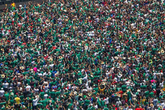 Mexico fans celebrate a goal scored by Julian Quinones as they watch the match between Mexico and South Africa during the FIFA Fan Festival at the LA Memorial Coliseum on opening day of the 2026 World Cup football tournament at in Los Angeles on June 11, 2026. Mexico and South Africa are opening the 2026 World Cup football tournament Group A, in Mexico City. (Photo by Apu GOMES / AFP)