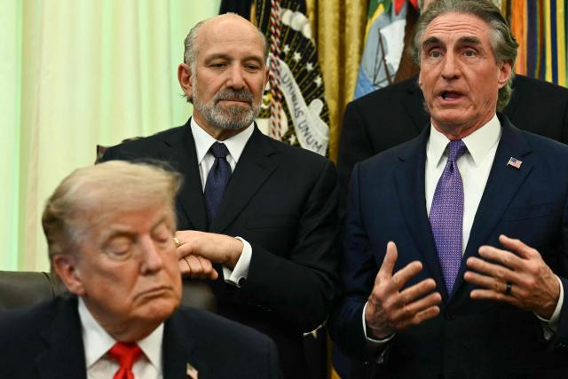 US Secretary of the Interior Doug Burgum (R) speaks as US President Donald Trump (L) and US Commerce secretary Howard Lutnick listen before Trump signs a proclamation in the Oval Office of the White House in Washington, DC, on June 11, 2026. (Photo by Kent NISHIMURA / AFP)