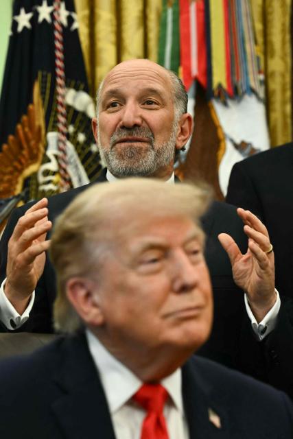 US President Donald Trump listens as US Commerce Secretary Howard Lutnick speaks before Trump signs a proclamation in the Oval Office of the White House in Washington, DC, on June 11, 2026. (Photo by Kent NISHIMURA / AFP)