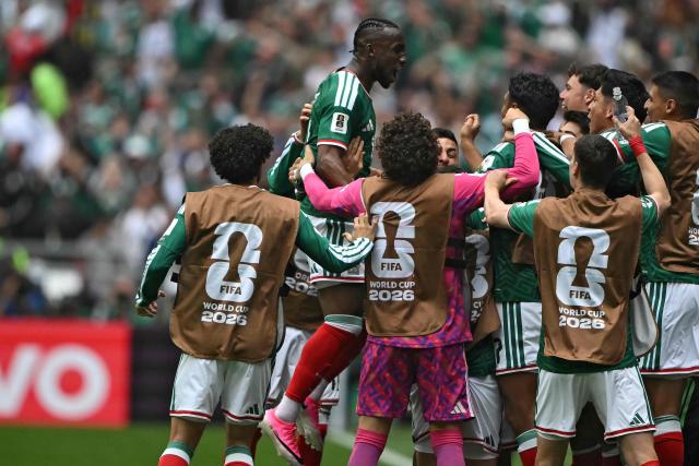 Mexico's forward #16 Julian Quinones celebrates with teammates scoring his team's first goal during the 2026 World Cup Group A football match between Mexico and South Africa at the Mexico City Stadium in Mexico City on June 11, 2026. (Photo by CARL DE SOUZA / AFP)
