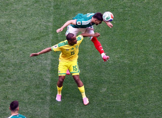 South Africa's forward #15 Iqraam Rayners and Mexico's defender #05 Johan Vasquez fight for the ball during the 2026 World Cup Group A football match between Mexico and South Africa at the Mexico City Stadium in Mexico City on June 11, 2026. (Photo by Rodrigo OROPEZA / AFP)