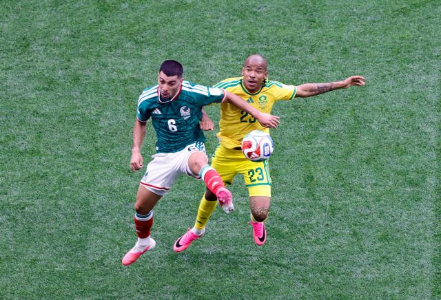 Mexico's midfielder #06 Erik Lira and South Africa's midfielder #23 Jayden Adams fight for the ball during the 2026 World Cup Group A football match between Mexico and South Africa at the Mexico City Stadium in Mexico City on June 11, 2026. (Photo by Rodrigo OROPEZA / AFP)