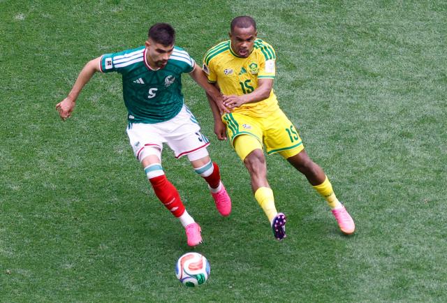 Mexico's defender #05 Johan Vasquez and South Africa's forward #15 Iqraam Rayners fight for the ball during the 2026 World Cup Group A football match between Mexico and South Africa at the Mexico City Stadium in Mexico City on June 11, 2026. (Photo by Rodrigo OROPEZA / AFP)