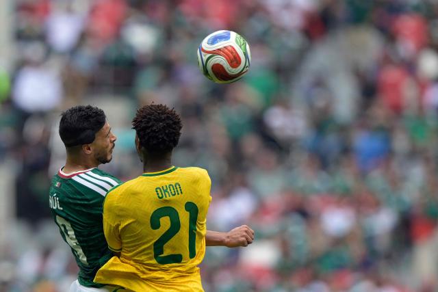 Mexico's forward #09 Raul Jimenez and South Africa's defender #21 Ime Okon fight for the ball during the 2026 World Cup Group A football match between Mexico and South Africa at the Mexico City Stadium in Mexico City on June 11, 2026. (Photo by Alfredo ESTRELLA / AFP)