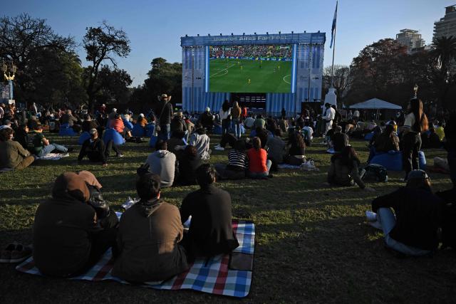 People watch the opening match of the 2026 World Cup, a Group A match between Mexico and South Africa in a giant screen in Buenos Aires on June 11, 2026. (Photo by Luis ROBAYO / AFP)
