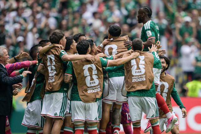 Mexico's forward #16 Julian Quinones (R) celebrates scoring his team's first goal during the 2026 World Cup Group A football match between Mexico and South Africa at the Mexico City Stadium in Mexico City on June 11, 2026. (Photo by Alfredo ESTRELLA / AFP)