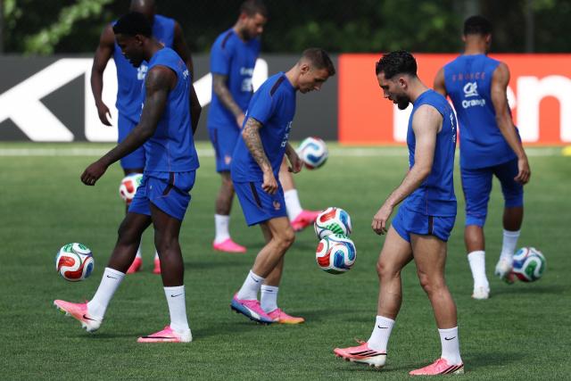 France's forward #24 Rayan Cherki (2R) takes part in a training session during the 2026 World Cup football tournament at Bentley University in Waltham, Boston on June 11, 2026. (Photo by FRANCK FIFE / AFP)
