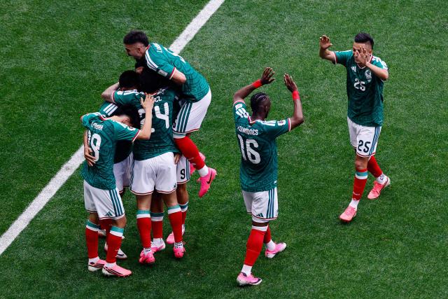 Mexico’s players celebrate the team’s second goal scored by forward #09 Raul Jimenez during the 2026 World Cup Group A football match between Mexico and South Africa at the Mexico City Stadium in Mexico City on June 11, 2026. (Photo by Rodrigo OROPEZA / AFP)