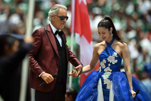 Italian singer Andrea Bocelli and South Korean–American singer, songwriter, and record producer Ejae perform during the opening ceremony ahead of the 2026 World Cup Group A football match between Mexico and South Africa at the Mexico City Stadium in Mexico City on June 11, 2026. (Photo by CARL DE SOUZA / AFP)