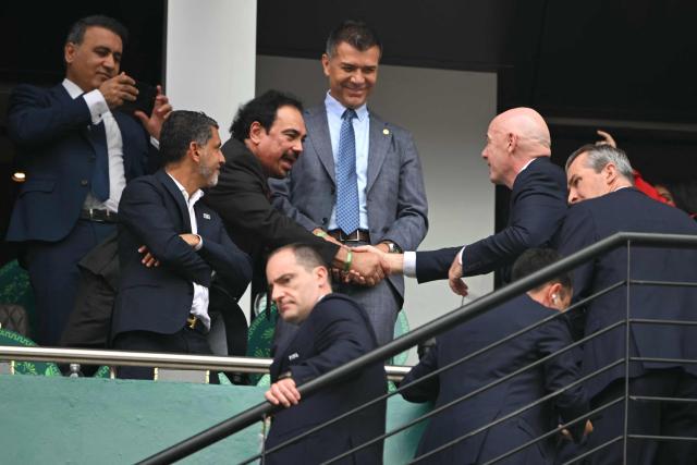 Mexican football legend Hugo Sanchez (L) shakes hands with FIFA President Gianni Infantino ahead of the 2026 World Cup Group A football match between Mexico and South Africa at the Mexico City Stadium in Mexico City on June 11, 2026. (Photo by CARL DE SOUZA / AFP)