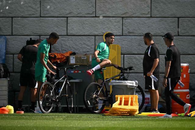 Morocco's defender Achraf Hakimi (C) arrives for a training session riding a bike during the 2026 World Cup football tournament at the Pingry School in Basking Ridge, New Jersey, on June 11, 2026. (Photo by MAURO PIMENTEL / AFP)