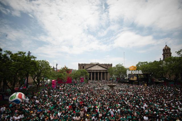 People gather at the FIFA Fan Festival Guadalajara at Plaza de la Liberacion and Plaza de Armas in Guadalajara, Jalisco state, Mexico, on June 11, 2026 during the opening of the FIFA World Cup 2026. (Photo by RUTH ROSAS / AFP)