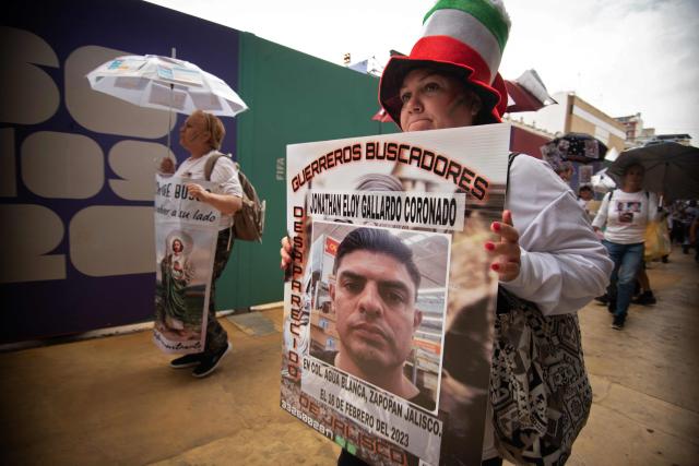 Relatives of missing persons and members of search collectives protest during the opening of the FIFA World Cup 2026 in downtown Guadalajara, Jalisco state, Mexico, on June 11, 2026. (Photo by RUTH ROSAS / AFP)