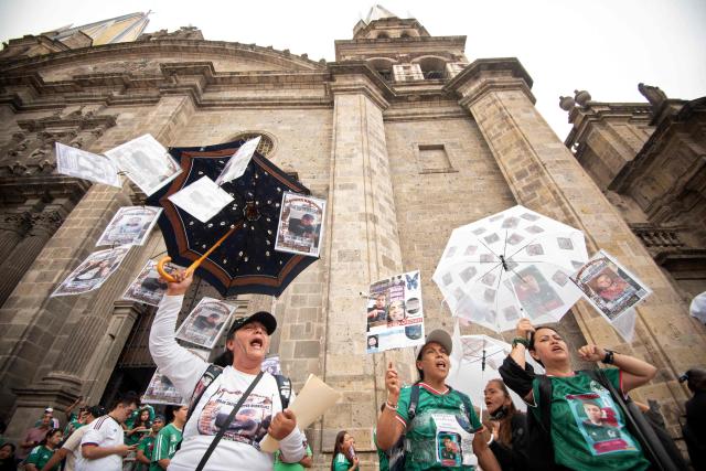 Relatives of missing persons and members of search collectives protest during the opening of the FIFA World Cup 2026 in downtown Guadalajara, Jalisco state, Mexico, on June 11, 2026. (Photo by RUTH ROSAS / AFP)