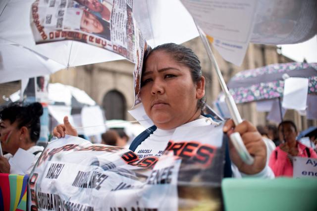 Relatives of missing persons and members of search collectives protest during the opening of the FIFA World Cup 2026 in downtown Guadalajara, Jalisco state, Mexico, on June 11, 2026. (Photo by RUTH ROSAS / AFP)