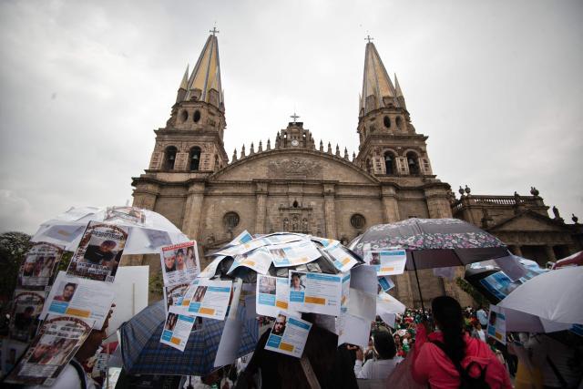 Relatives of missing persons and members of search collectives protest during the opening of the FIFA World Cup 2026 in downtown Guadalajara, Jalisco state, Mexico, on June 11, 2026. (Photo by RUTH ROSAS / AFP)