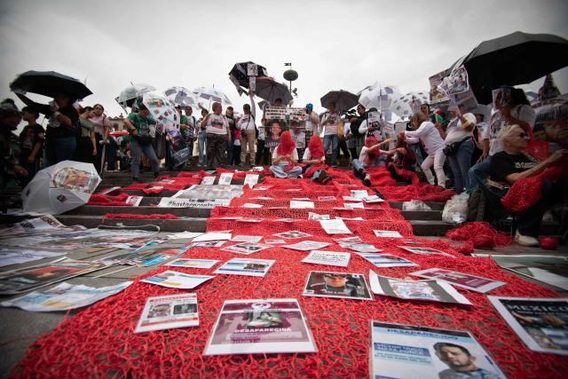 Relatives of missing persons and members of search collectives protest during the opening of the FIFA World Cup 2026 in downtown Guadalajara, Jalisco state, Mexico, on June 11, 2026. (Photo by RUTH ROSAS / AFP)
