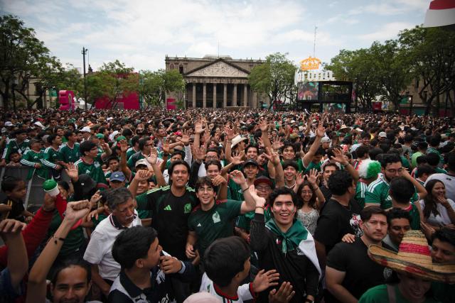 People gather at the FIFA Fan Festival Guadalajara at Plaza de la Liberacion and Plaza de Armas in Guadalajara, Jalisco state, Mexico, on June 11, 2026 during the opening of the FIFA World Cup 2026. (Photo by RUTH ROSAS / AFP)