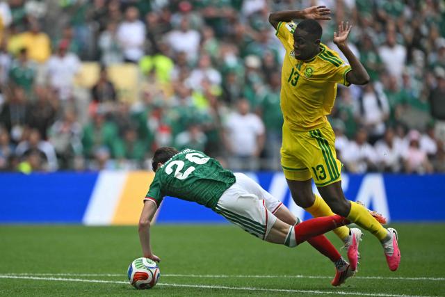 Mexico's midfielder #26 Brian Gutierrez is fouled by South Africa's midfielder #13 Sphephelo Sithole during the 2026 World Cup Group A football match between Mexico and South Africa at the Mexico City Stadium in Mexico City on June 11, 2026. (Photo by CARL DE SOUZA / AFP)