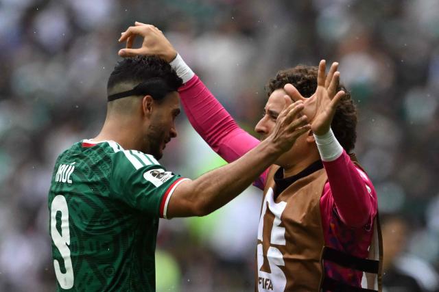 Mexico's forward #09 Raul Jimenez celebrates scoring his team's second goal wuth teammate goalkeeper #13 Guillermo Ochoa during the 2026 World Cup Group A football match between Mexico and South Africa at the Mexico City Stadium in Mexico City on June 11, 2026. (Photo by CARL DE SOUZA / AFP)