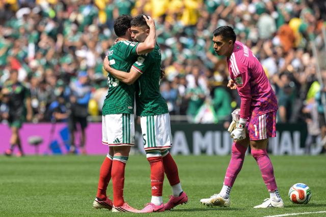 Mexico's defender #15 Israel Reyes (L) and defender #05 Johan Vasquez (C) celebrate at the end of the 2026 World Cup Group A football match between Mexico and South Africa at the Mexico City Stadium in Mexico City on June 11, 2026. (Photo by Alfredo ESTRELLA / AFP)