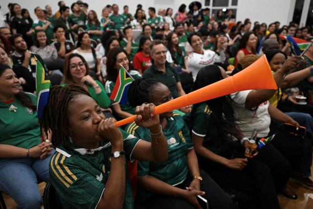 Mexican and South African fans react as they watch the live broadcast of the World Cup Group A football match between Mexico and South Africa at the Mexican embassy in Beijing on June 12, 2026. (Photo by Pedro PARDO / AFP)