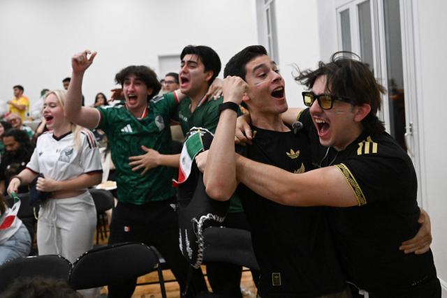 Mexican fans react as they watch the live broadcast of the World Cup Group A football match between Mexico and South Africa at the Mexican embassy in Beijing on June 12, 2026. (Photo by Pedro PARDO / AFP)