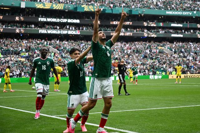 Mexico's forward #09 Raul Jimenez celebrates with teammates scoring his team's second goal during the 2026 World Cup Group A football match between Mexico and South Africa at the Mexico City Stadium in Mexico City on June 11, 2026. (Photo by CARL DE SOUZA / AFP)