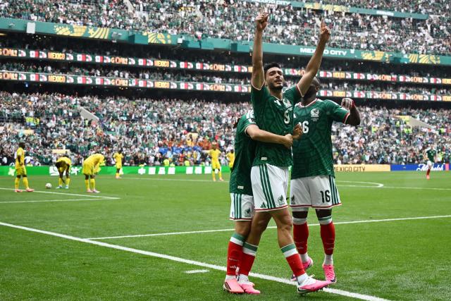 Mexico's forward #09 Raul Jimenez celebrates with teammates scoring his team's second goal during the 2026 World Cup Group A football match between Mexico and South Africa at the Mexico City Stadium in Mexico City on June 11, 2026. (Photo by CARL DE SOUZA / AFP)