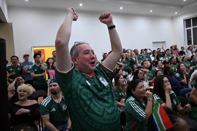 Mexican fans react as they watch the live broadcast of the World Cup Group A football match between Mexico and South Africa at the Mexican embassy in Beijing on June 12, 2026. (Photo by Pedro PARDO / AFP)
