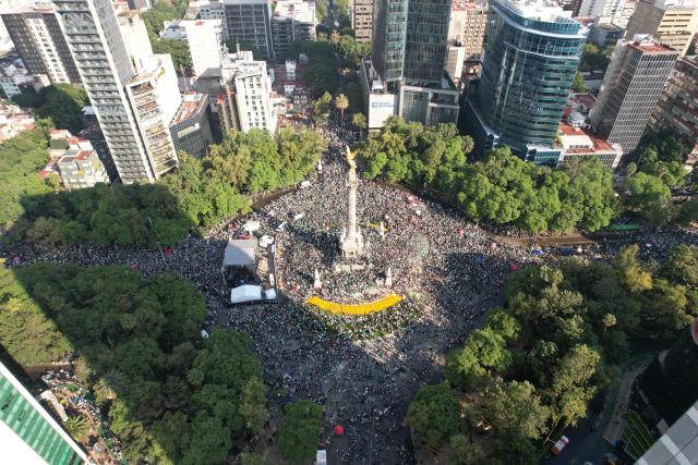 Aerial view of Mexico fans celebrating at the Angel de la Independencia monument in Mexico City on June 11, 2026, after the FIFA World Cup match between Mexico and South Africa. (Photo by LUIS CORTES / AFP)