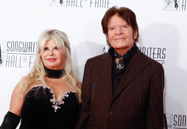 US singer songwriter John Fogerty, recipient of the Johnny Mercer Special Award, and his wife Julie Lebiedzinski attend the 55th Annual Songwriters Hall of Fame Induction and Awards Gala at the Marriott Marquis Hotel in New York on June 11, 2026. (Photo by kena betancur / AFP)
