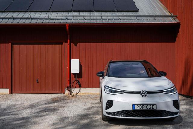 A bi-directional Vehicle-to-Grid (V2G) charging station is pictured at the BRF Stenberg condominium association on May 28, 2026, in Hudiksvall, Sweden. The residential pilot project uses Vehicle-to-Grid (V2G) technology, enabling electric vehicles to act as mobile energy storage units capable of supplying electricity back to the local grid when needed. (Photo by Jonathan NACKSTRAND / AFP)